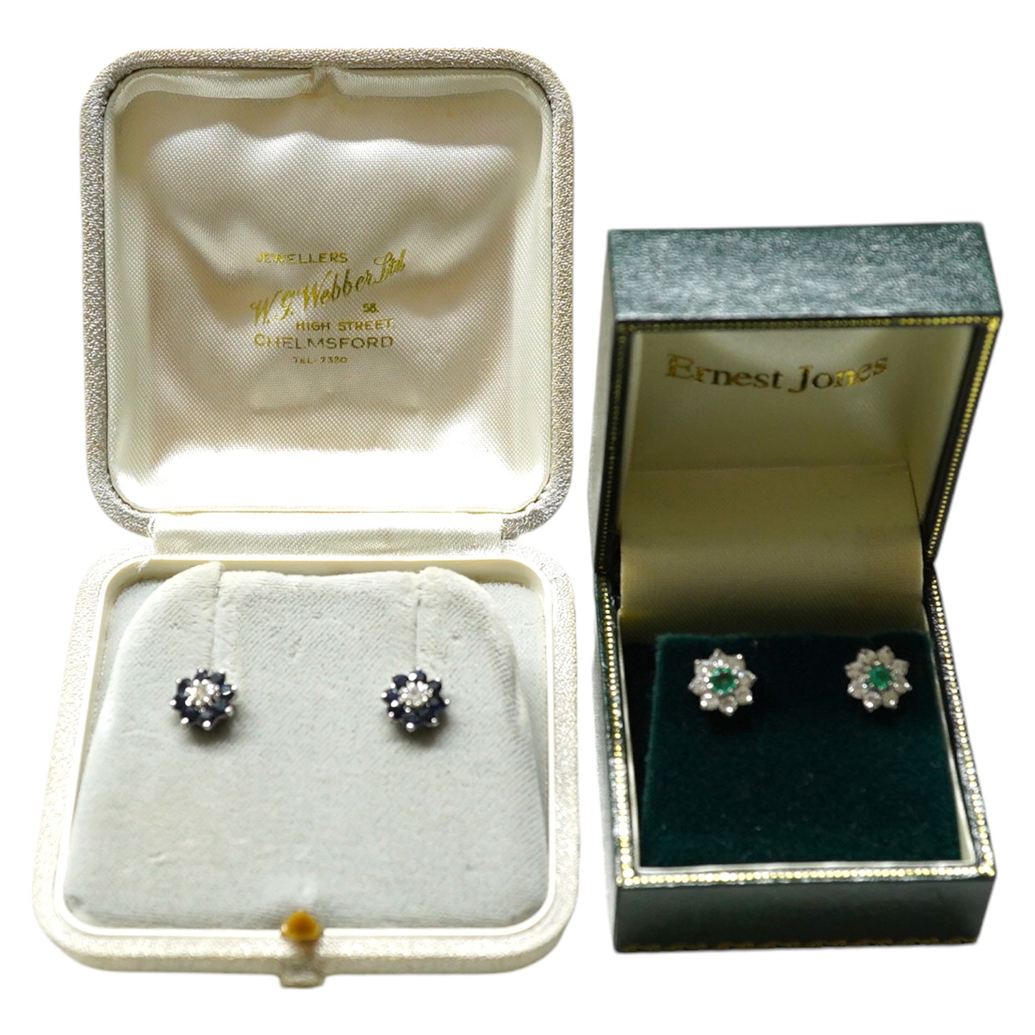 A modern pair of 9ct, emerald and diamond set flower head cluster ear studs, 8mm and a similar pair of sapphire and diamond cluster ear studs. Condition - fair to good